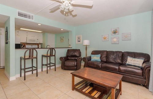 Rockport Condo | Large balcony that overlooks the bay, pool, and fishing pier!