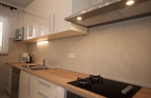 Baska Apartment | Large flat with 3 air conditioning units, WiFi, BBQ, car park