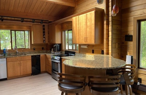 Sand Lake House | Large luxurious lakefront home with water toys & mountain view