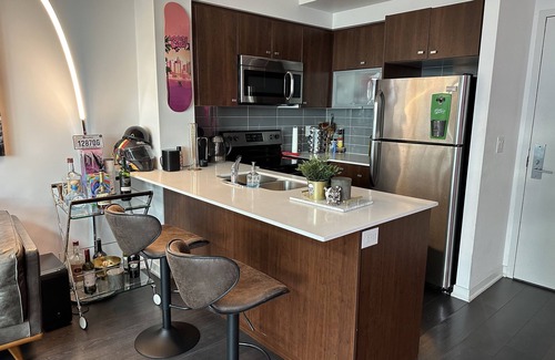 King West Village Condo | Liberty Village charm, vibrant community, and a spacious loft await your stay!