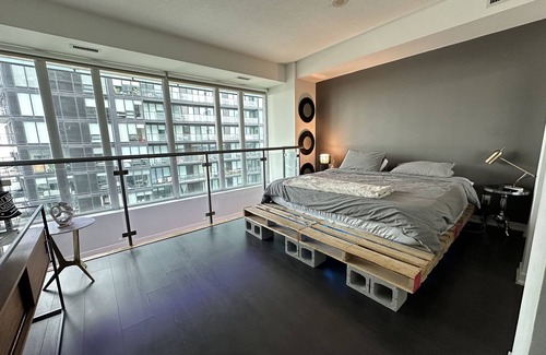 King West Village Condo | Liberty Village charm, vibrant community, and a spacious loft await your stay!