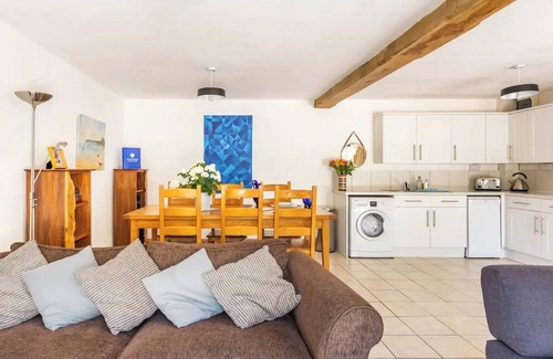 Kemeys Commander Cottage | Light and spacious cottage, with exposed oak beams and floor to ceiling windows