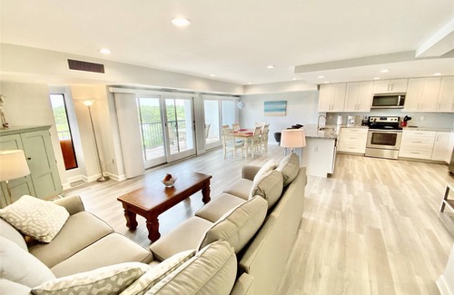 Rehoboth Beach Condo | LINENS & DAILY ACTIVITIES INCLUDED! OCEANFRONT/BOARDWALK BUILDING W/ROOFTOP POOL Completely remodeled kitchen with all-new cabinets and appliances, open floor plan and eat-at counter.