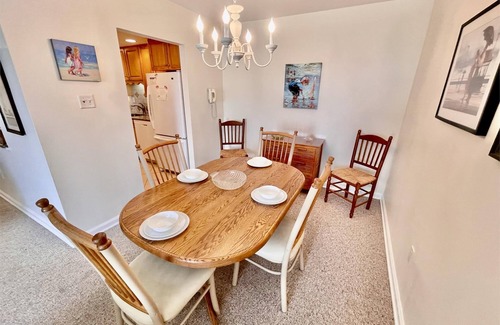 Rehoboth Beach Condo | LINENS & DAILY ACTIVITIES INCLUDED! OCEANFRONT/BOARDWALK BUILDING W/ROOFTOP POOL Furnished for comfort after a day in the sun. Relax in this 1100 sq ft unit with great southern exposure and lovely ocean views
