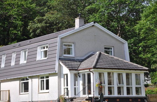 West Laroch Cottage | Lochside with beach access uninterrupted views of spectacular Highland Mountains