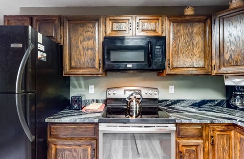 Wildernest Condo | Lofty condo with beautiful mountain & lake views plus wood fireplace