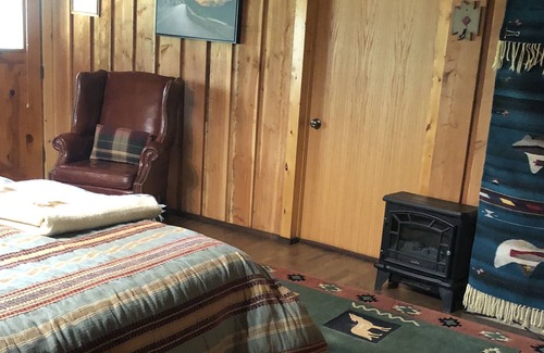 Bigfork Apartment | Log home studio in the woods. Pet friendly.