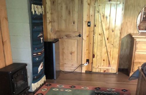 Bigfork Apartment | Log home studio in the woods. Pet friendly.