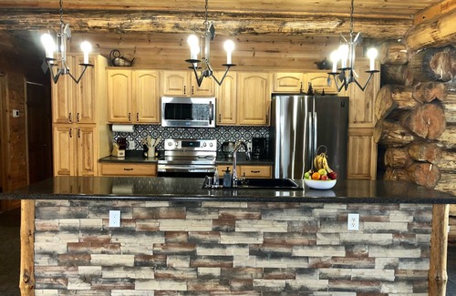 Brainerd House | Log home surrounded by woods near Upper South Long Lake