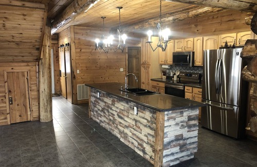 Brainerd House | Log home surrounded by woods near Upper South Long Lake