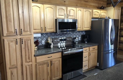 Brainerd House | Log home surrounded by woods near Upper South Long Lake