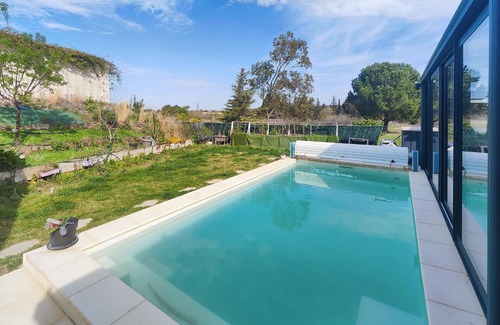 Bessan House | Look forward to this attractive vacation home with conservatory and pool.
