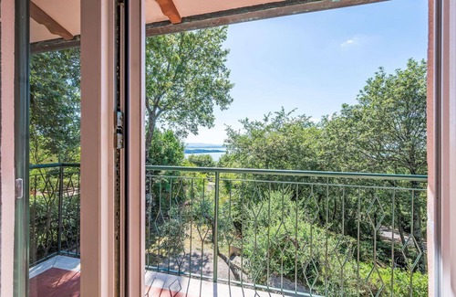 San Feliciano Apartment | Lovely apartment for 4 guests with A/C, WIFI, pool, TV, patio and pets allowed
