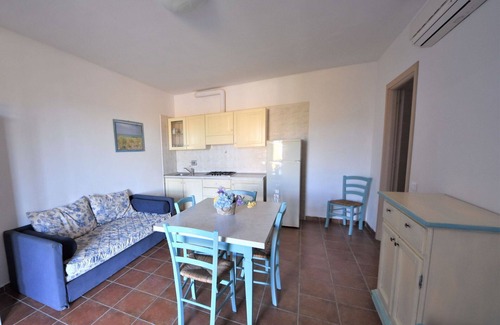 Follonica Apartment | Lovely apartment for 6 guests with pool, A/C, TV, patio and pets allowed