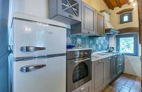 Castagneto Carducci Villa | Lovely apartment in villa for 5 guests with A/C, pool, WIFI, TV, patio and pets allowed