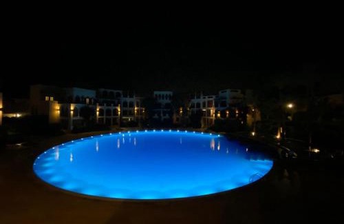 Aqaba Apartment | Lovely first floor tow bed rooms overviewing circular pool for families only in Talabay Aqaba