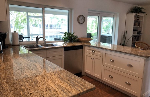 Bal Harbour House | Lovely House on the canal with private dock, large fenced yard & pet friendly