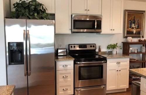 Bal Harbour House | Lovely House on the canal with private dock, large fenced yard & pet friendly