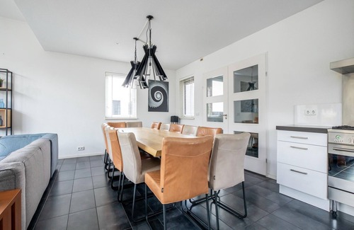 Zeewolde House | Luxurious 12-person houseboat with jacuzzi, sauna, 5 bedrooms, and garden by the water. Includes swim ladder, covered balcony, and large dining table. Located at Villa Resort Harderwold near the Veluwemeer!