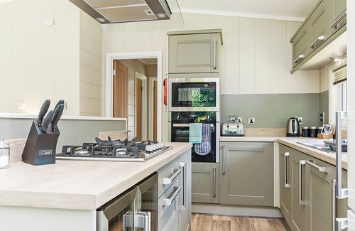 Newton St Loe Ski Chalet | Luxurious lodge with one king-size double, with en suite shower and one twin.