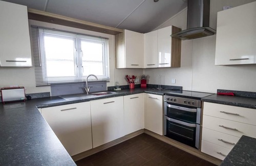 Hunstanton House | Luxury 6 berth lodge with decking at Manor Park in Hunstanton ref 23205K