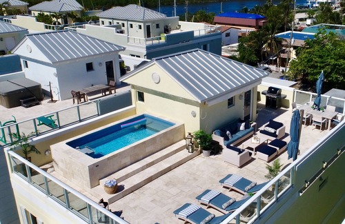 North Beach House | Luxury Beach Villa with Private Rooftop Pool & Elevator, Steps to Tranquil Beach