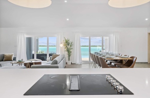 Hartswell Villa | Luxury beachfront villa with dock and a private large heated pool. For 10 people