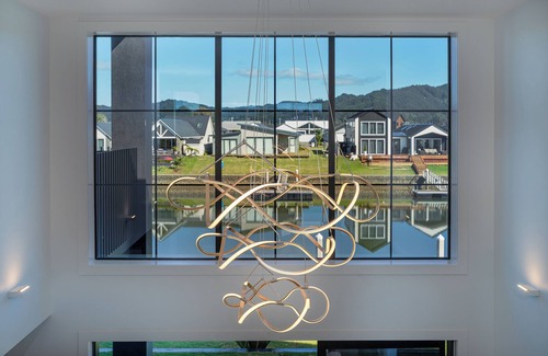 Whitianga House | Luxury Canal Front Home in Whitianga with Private Pontoon for Mooring Boat