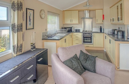 Tan-y-groes Ski Chalet | Luxury lodge with two doubles, one with en suite shower and one twin.