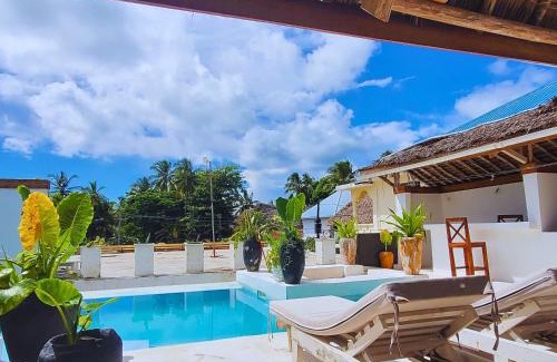 Paje Villa | Luxury Penthouse with private rooftop pool prime location Paje Beach Zanzibar TV WIFI AC steps to the beach