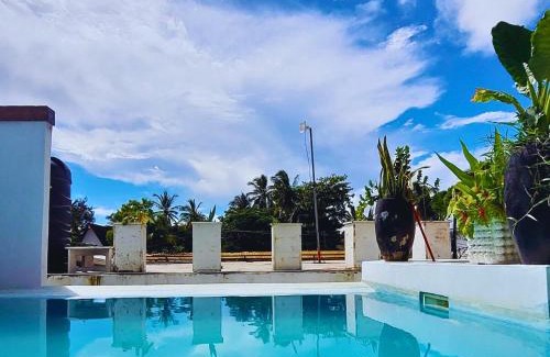 Paje Villa | Luxury Penthouse with private rooftop pool prime location Paje Beach Zanzibar TV WIFI AC steps to the beach