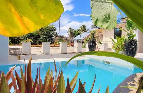 Paje Villa | Luxury Penthouse with private rooftop pool prime location Paje Beach Zanzibar TV WIFI AC steps to the beach