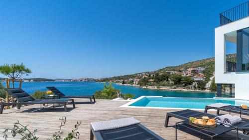 Rogoznica Villa | Luxury Seafront Villa Roots with private, heated pool, 5 en-suite bedrooms, enchanting sea views