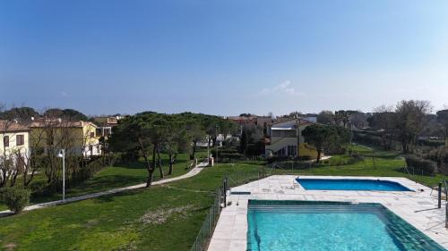Numana Apartment | M375 - Marcelli, bilocale con giardino in residence con piscina