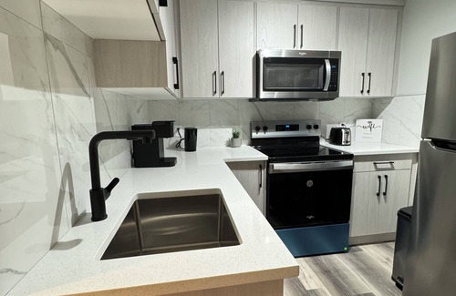 Southwest Calgary House | Modern 2-bedroom suite - Cozy vibes & Great Location.