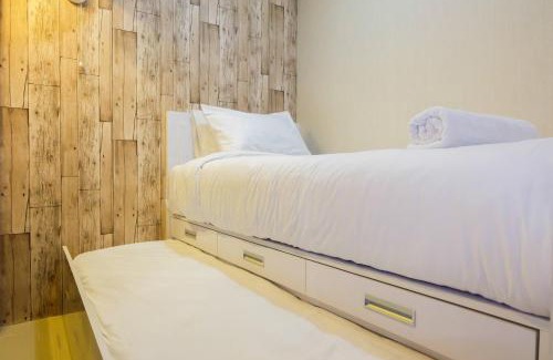 Jatinegara Apartment | Modern 2BR with City View at Bassura Apartment By Travelio