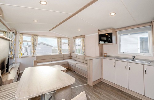 Otterton House | Modern and spacious 12ft-wide caravan with one double and two twin.