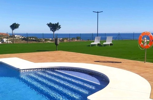 Puerto de la Duquesa House | Modern apartment in Manilva with shared pool and 5 minutes walk of the sea