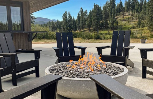 Clancy Cabin | Modern cabin on 10 creek front acres with large gas fire pit.