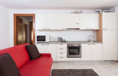 Riva del Garda Apartment | Modern, Centrally Located Apartment "RivApartmentsDowntowN - Love" with a View of the Old Town of Riva del Garda, A/C & Wi-Fi