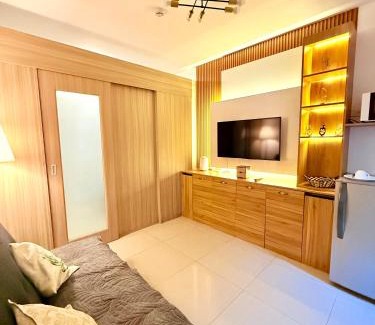 Barangay 76 Apartment | Modern Double-Sized Bed with Netflix & Pool View