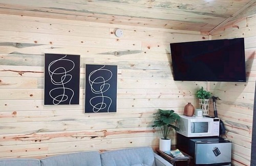Alexandria Cabin | Modern lakeside cabin with panoramic views and deck.