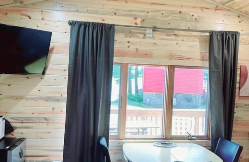 Alexandria Cabin | Modern lakeside cabin with panoramic views and deck.