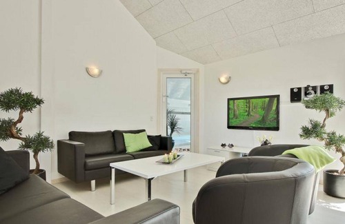 Harboore House | Modern pool house for large group with a view of the Ferringsee