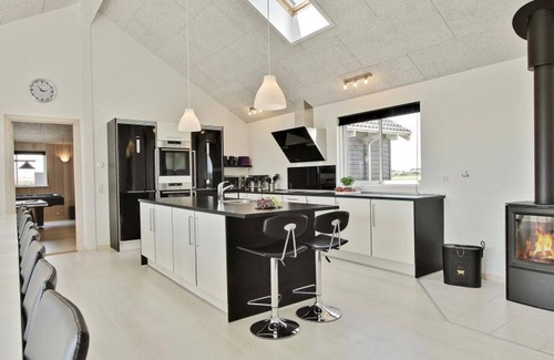Harboore House | Modern pool house for large group with a view of the Ferringsee