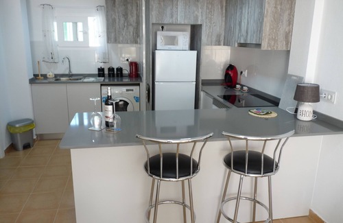Lomas Apartment | Modern south facing Apartment with Sun Terrace 10 minute walk to sandy beach.