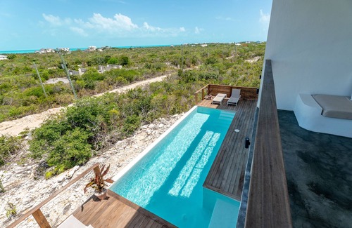 Long Bay Apartment | Modern Studio with Expansive Ocean View, Pool
