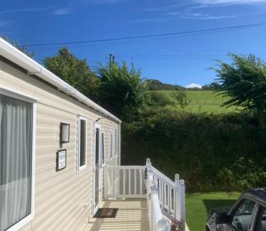 Newquay House | Mollys Retreat pet friendly three bed caravan with small garden Newquay Bay Resort Quieter area of park