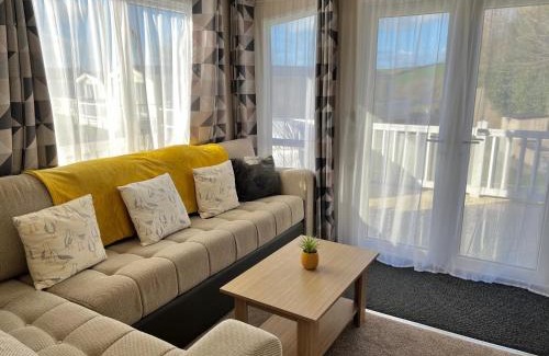 Newquay House | Mollys Retreat pet friendly three bed caravan with small garden Newquay Bay Resort Quieter area of park