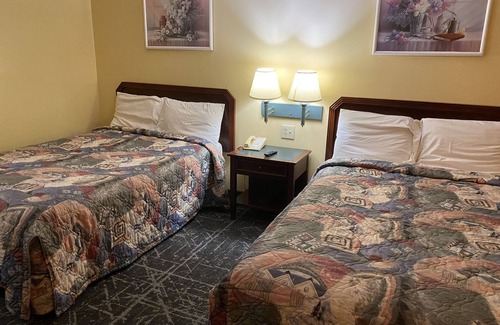 Dublin Hotel | Motel with hot tub and surrounded with greenery and hills.